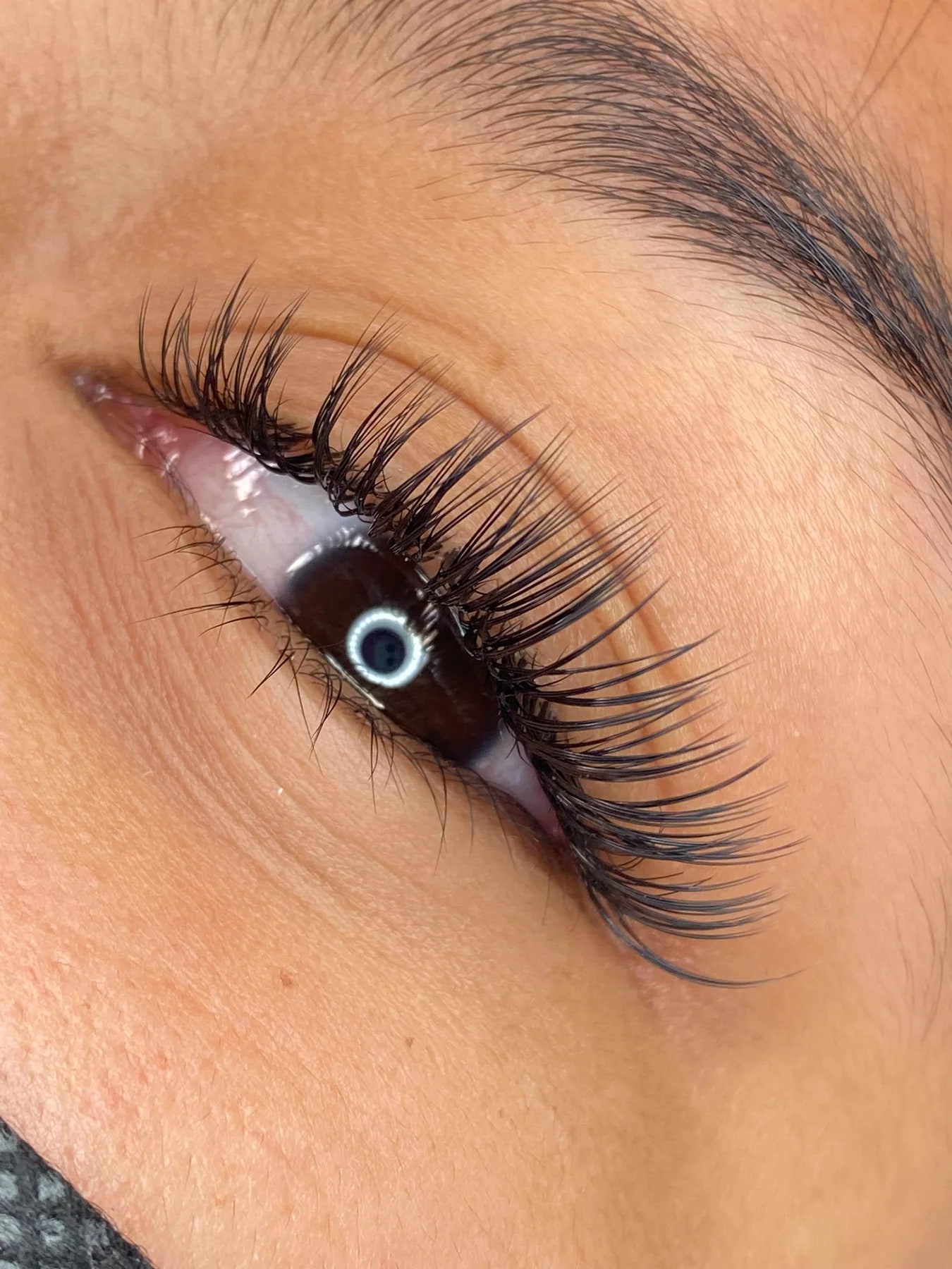 Client eye detail with polished lashes